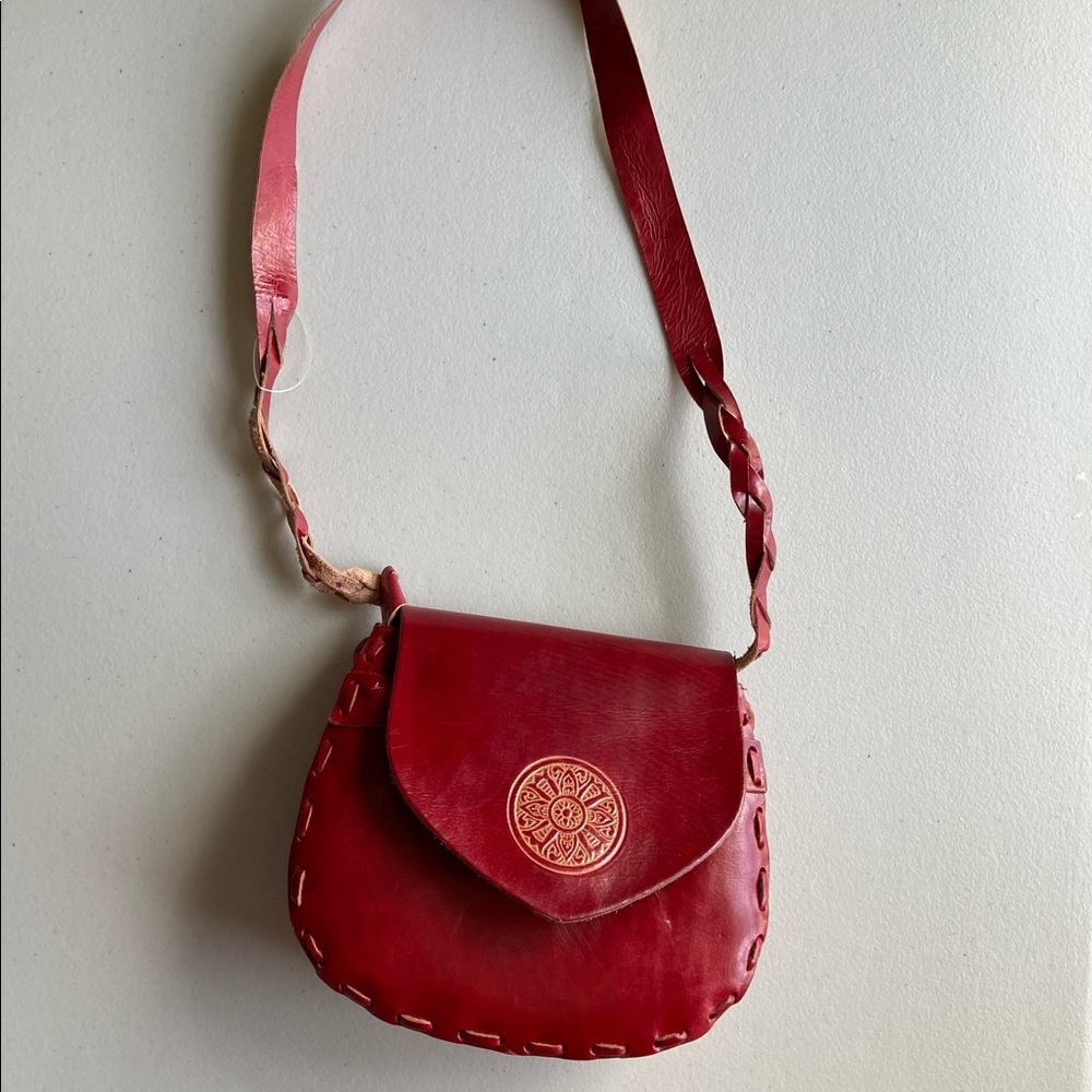 Handmade leather red handbag with ethnic ornament